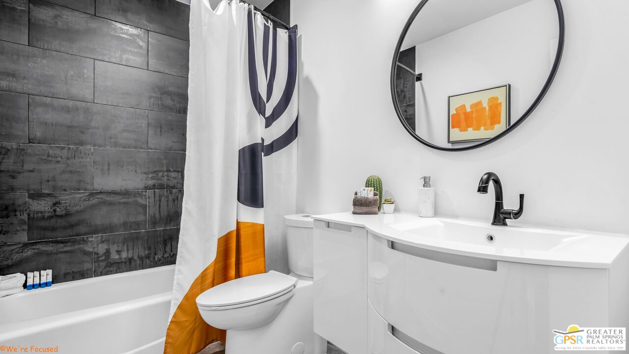 545 West Yorba Road Palm Springs, CA 92262 - Photo 37 of 72 a bathroom with a toilet a sink and a mirror