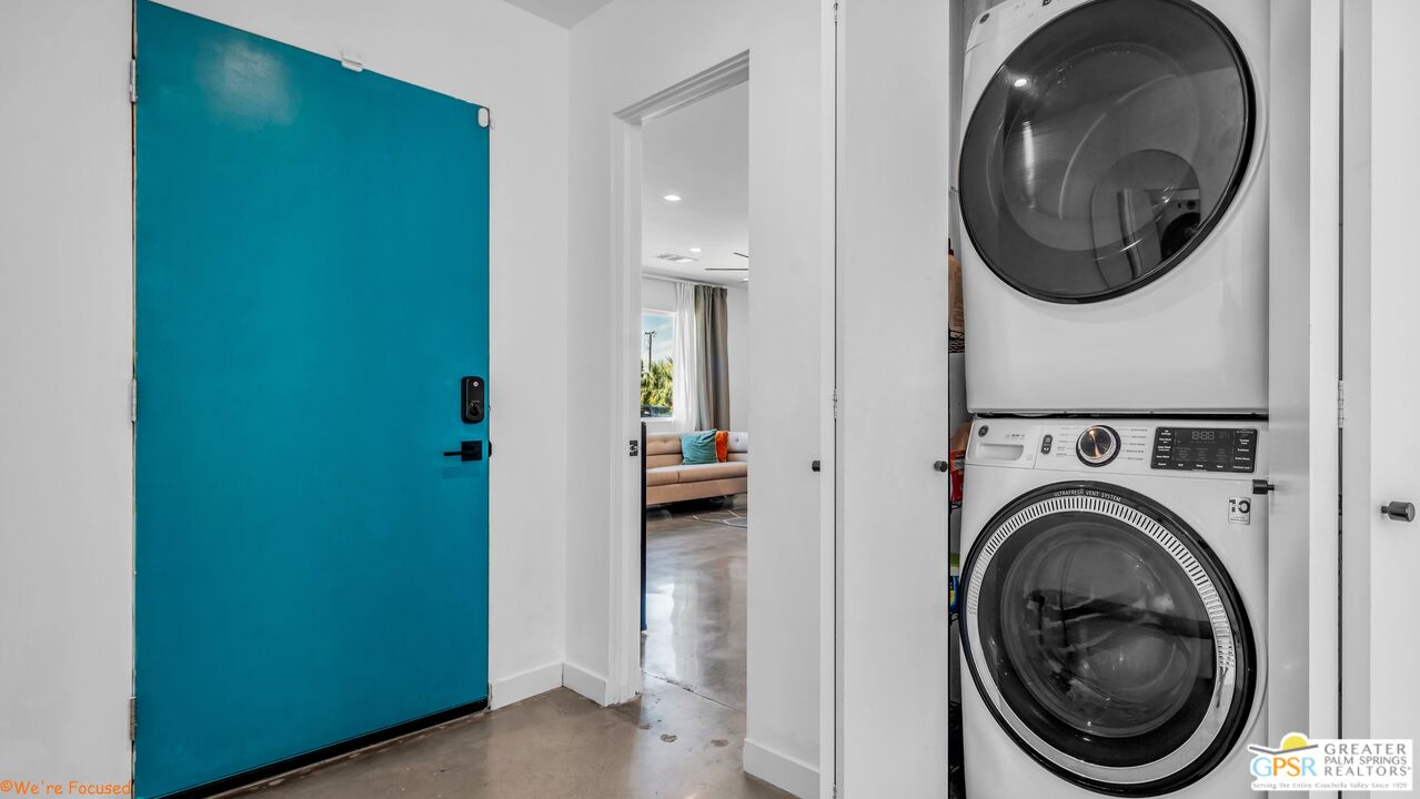 545 West Yorba Road Palm Springs, CA 92262 - Photo 39 of 72 a view of a hallway with washer and dryer
