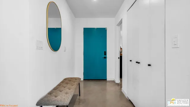 a view of a chairs and table in the backyard