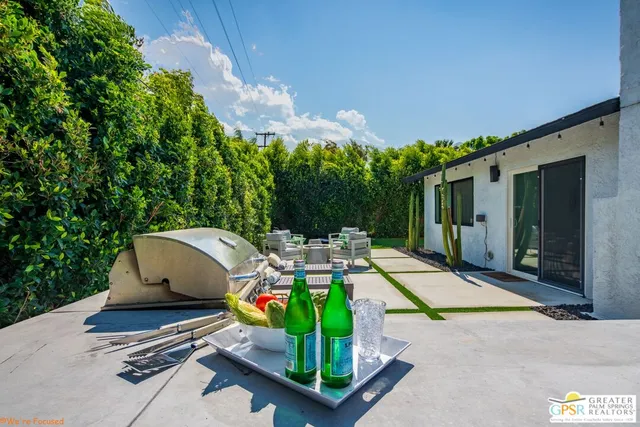 a view of swimming pool in front of house with yard