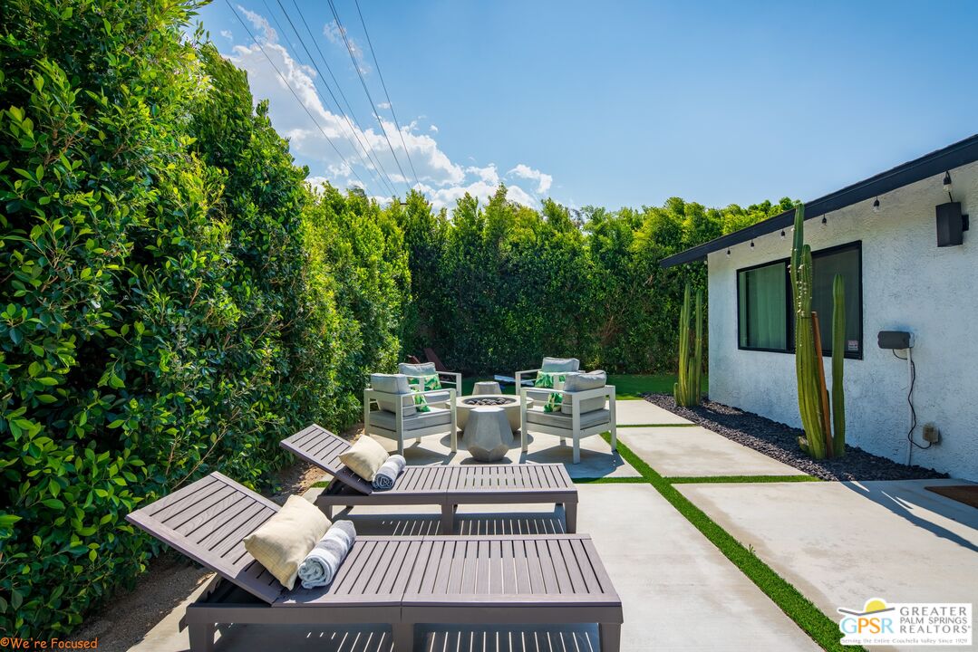 545 West Yorba Road Palm Springs, CA 92262 - Photo 54 of 72 a view of a patio with couches and table and chairs and potted plants