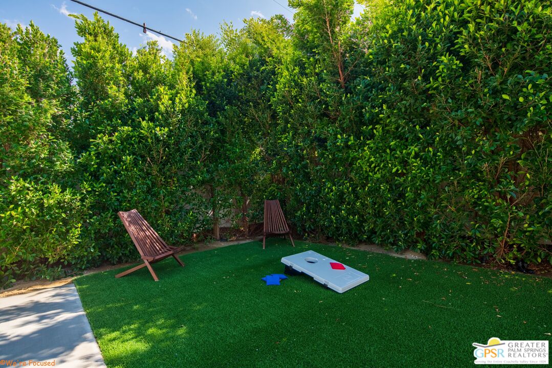 545 West Yorba Road Palm Springs, CA 92262 - Photo 56 of 72 a view of a garden with a bench