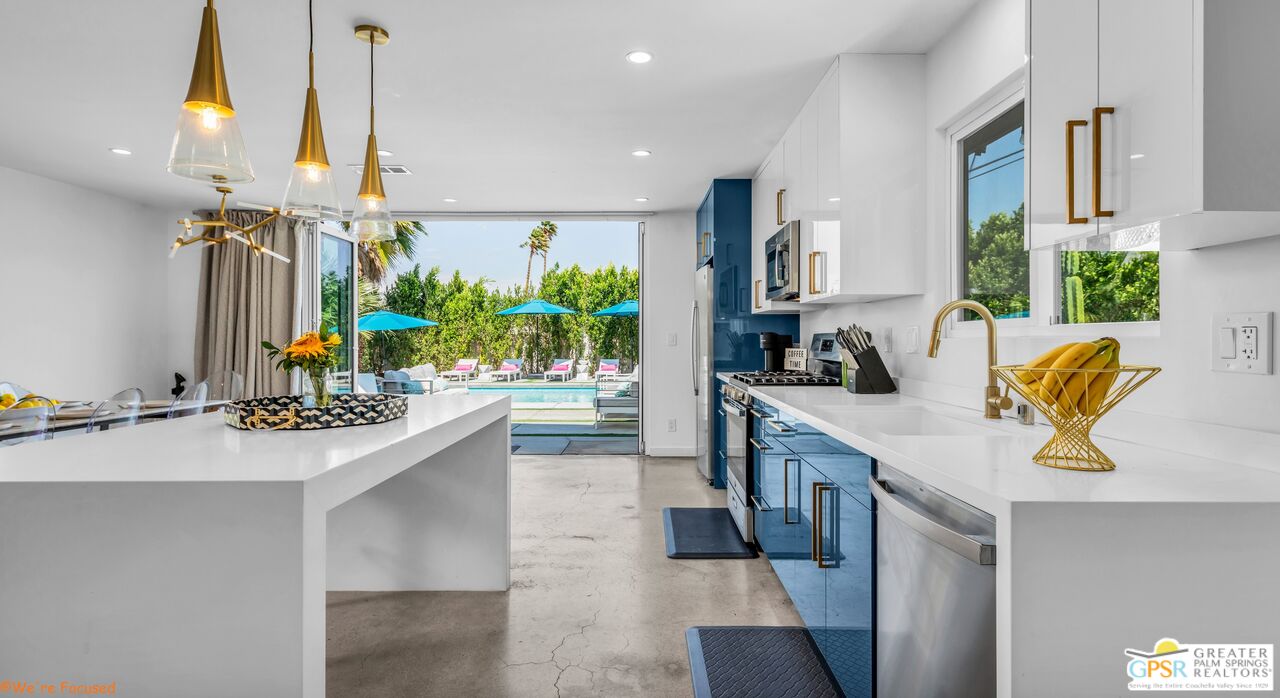 545 West Yorba Road Palm Springs, CA 92262 - Photo 7 of 72 a kitchen with a sink and a stove top oven