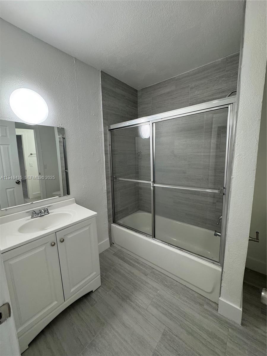 1799 Southwest 36th Avenue, Unit 1 Miami, FL 33145 - Photo 14 of 14 a view of bathroom with a sink and mirror