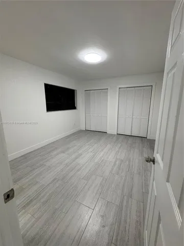 a view of a livingroom with wooden floor