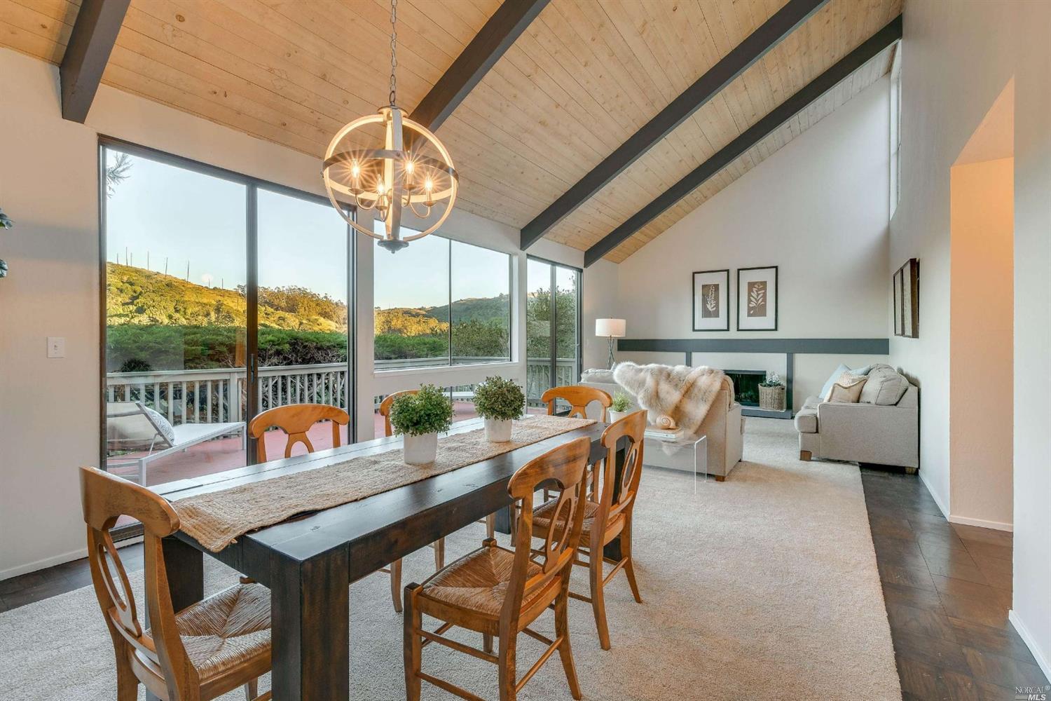 343 Carrera Drive Mill Valley, CA 94941 - Photo 1 of 1 a dining room with furniture a chandelier and wooden floor