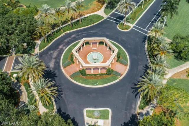 an aerial view of a house with a swimming pool and a garden