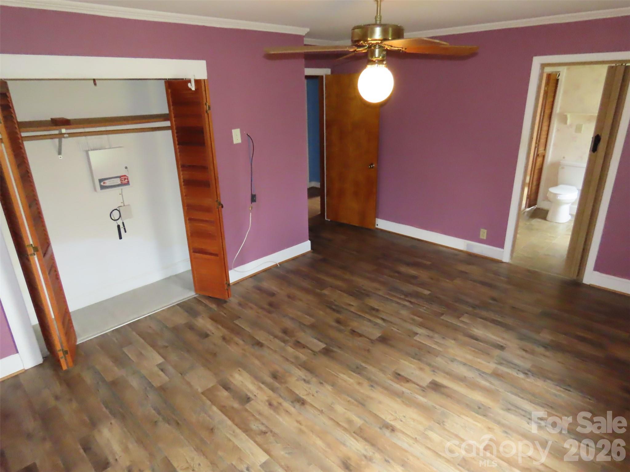 2724 Lucy Short Cut Road Marshville, NC 28103 - Photo 15 of 28 an empty room with wooden floor and windows