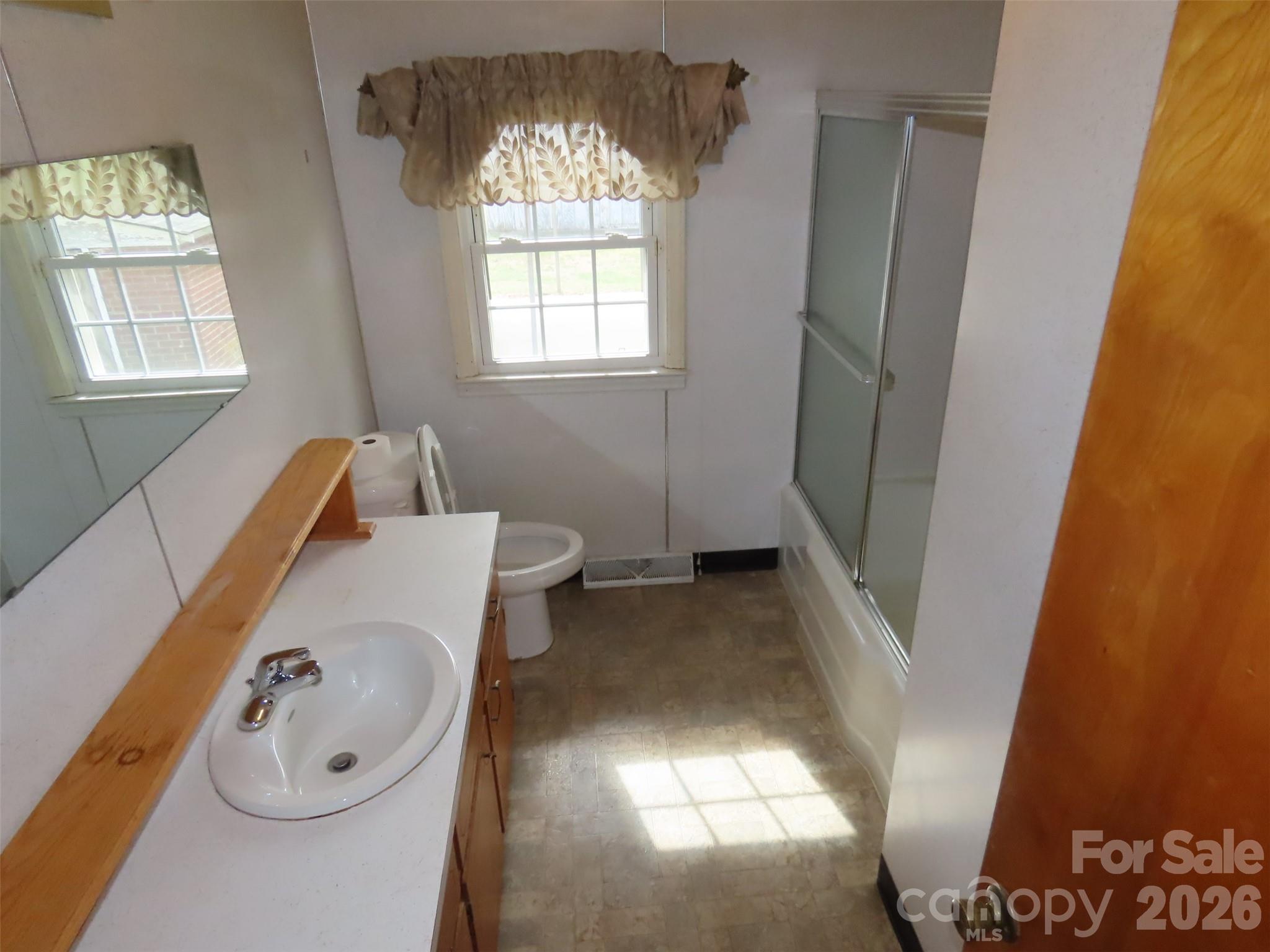 2724 Lucy Short Cut Road Marshville, NC 28103 - Photo 17 of 28 a bathroom with a sink and a bathtub