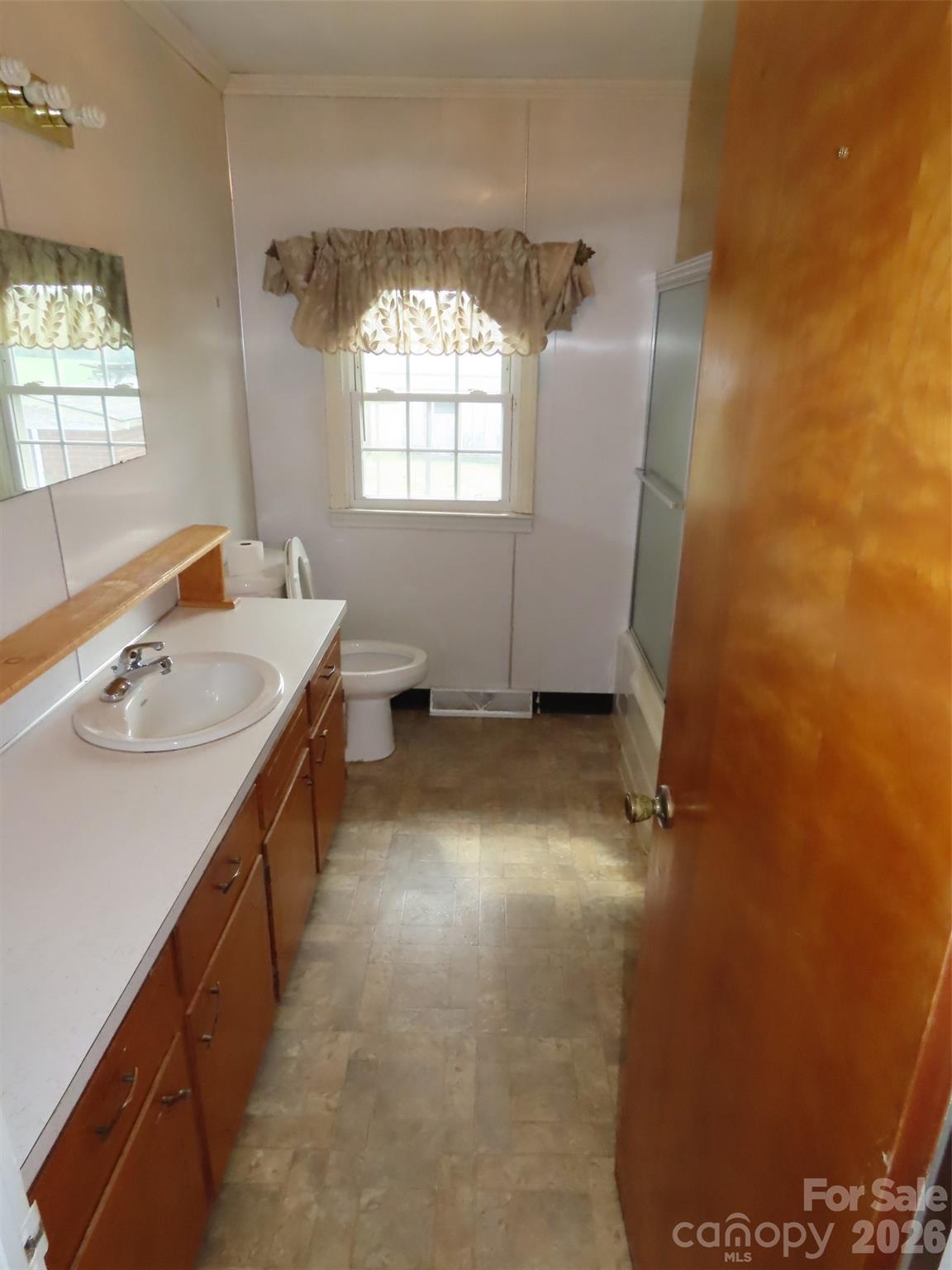 2724 Lucy Short Cut Road Marshville, NC 28103 - Photo 18 of 28 a bathroom with a sink toilet and tub