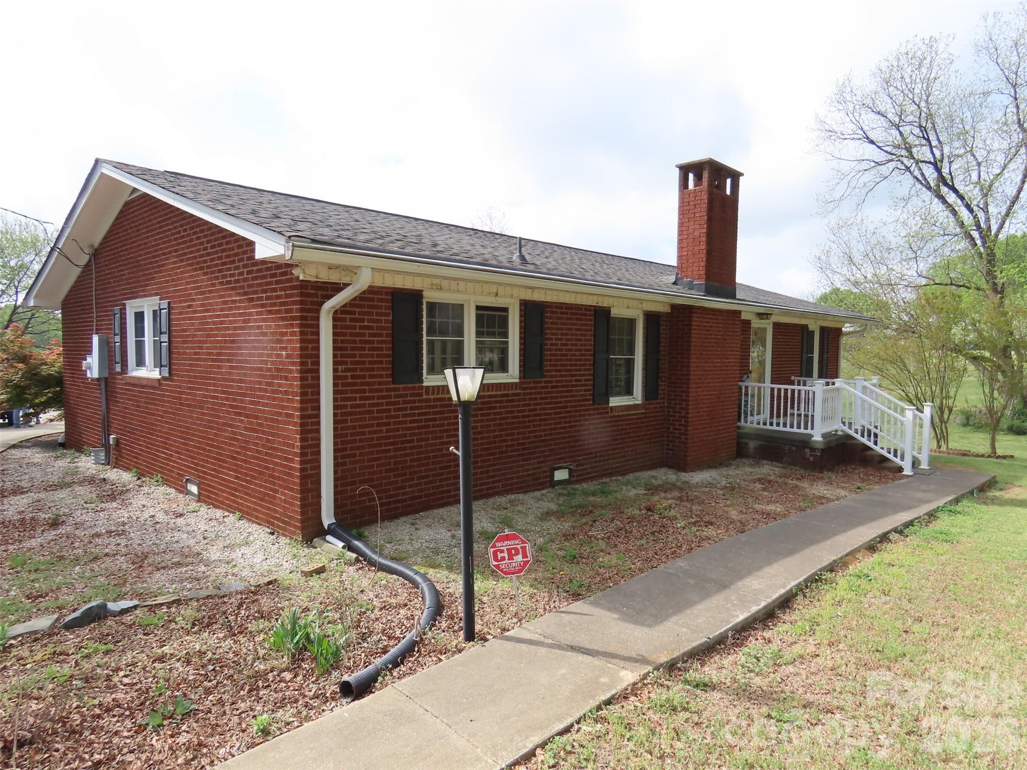2724 Lucy Short Cut Road Marshville, NC 28103 - Photo 2 of 28 a front view of a house with a garden