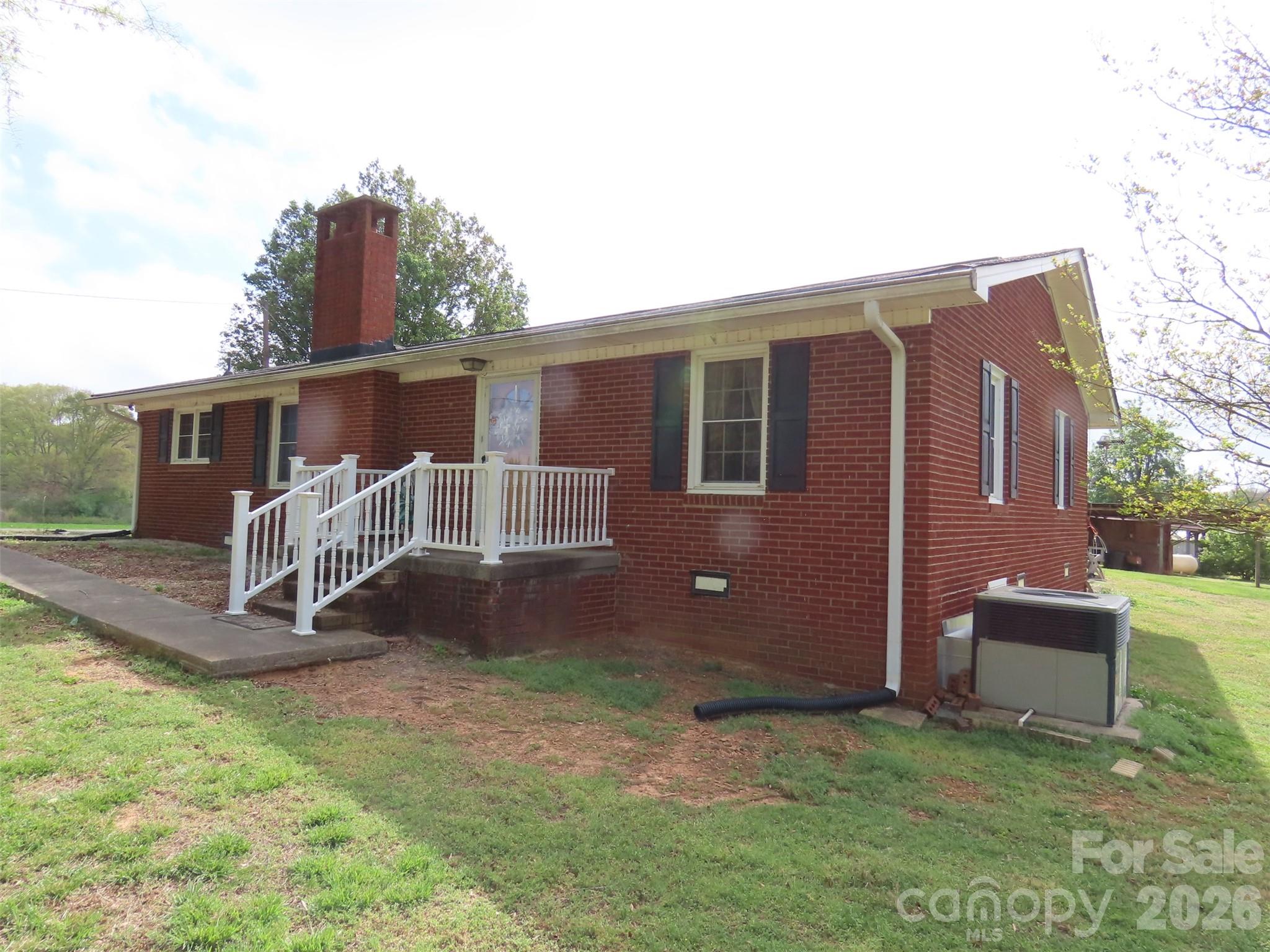 2724 Lucy Short Cut Road Marshville, NC 28103 - Photo 3 of 28 a front view of a house with a yard