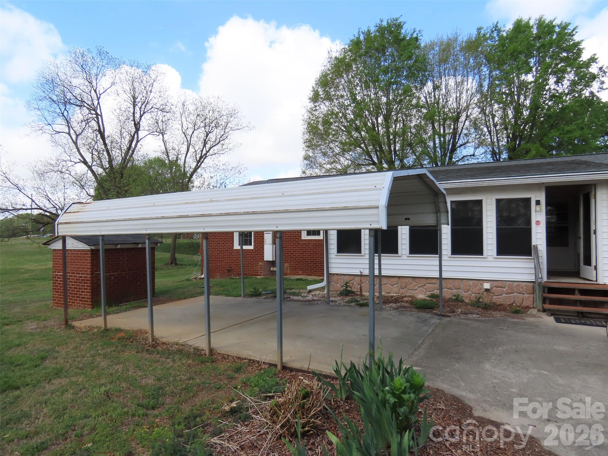 2724 Lucy Short Cut Road Marshville, NC 28103 - Photo 6 of 28 a view of a house with a backyard