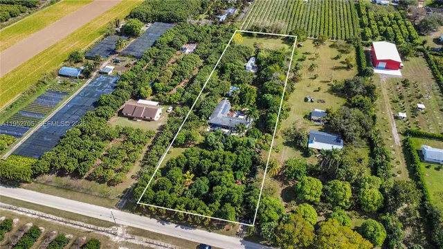 an aerial view of a residential houses with outdoor space