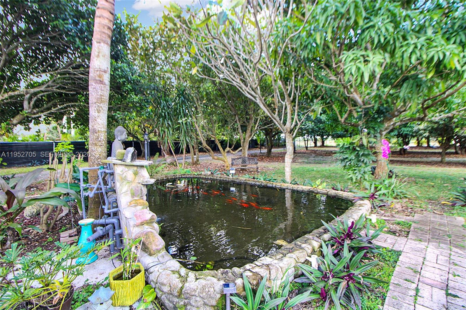 37225 Southwest 214th Avenue Homestead, FL 33034 - Photo 18 of 77 a view of swimming pool with sitting area