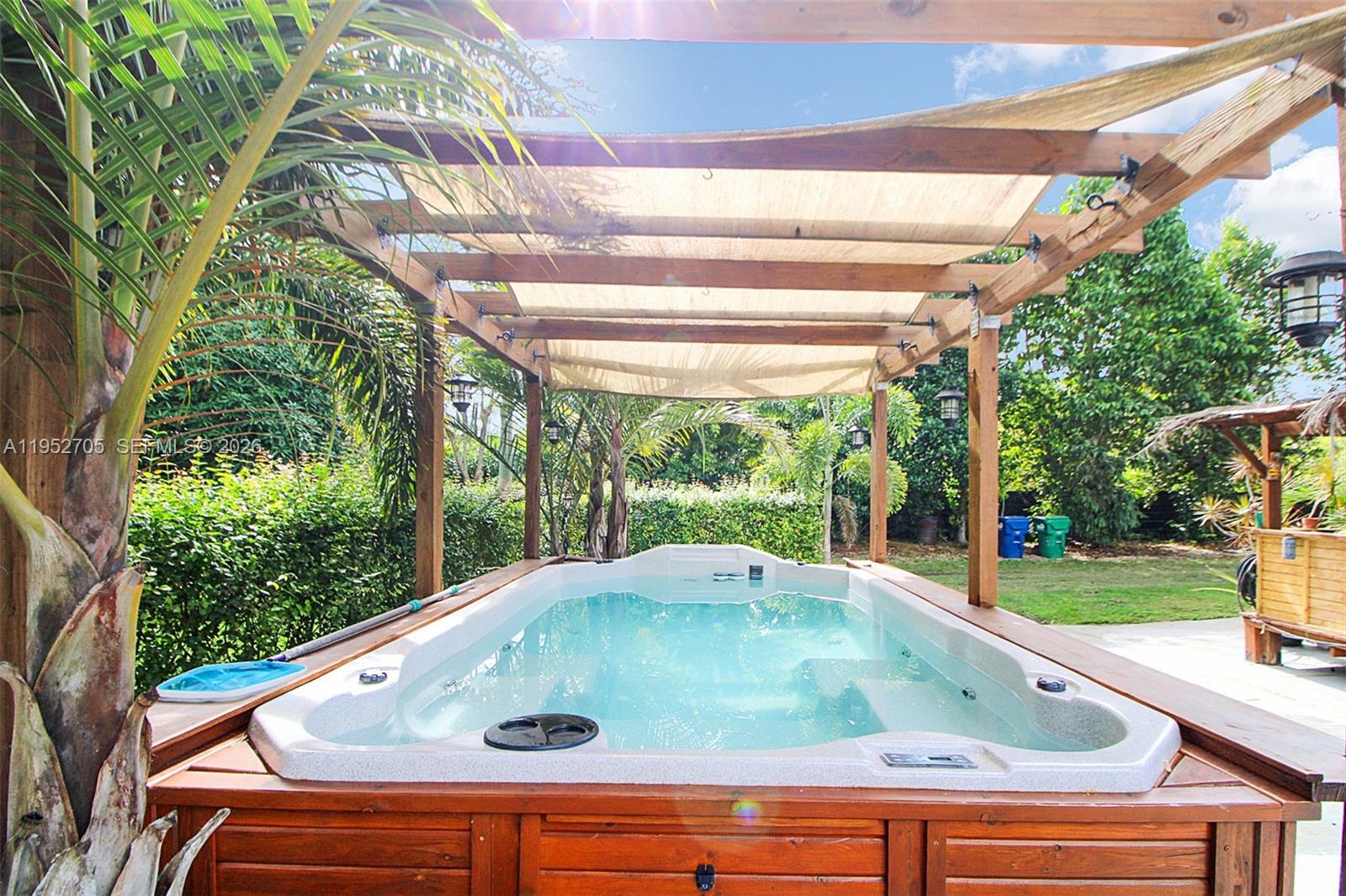 37225 Southwest 214th Avenue Homestead, FL 33034 - Photo 32 of 77 a view of swimming pool with a yard