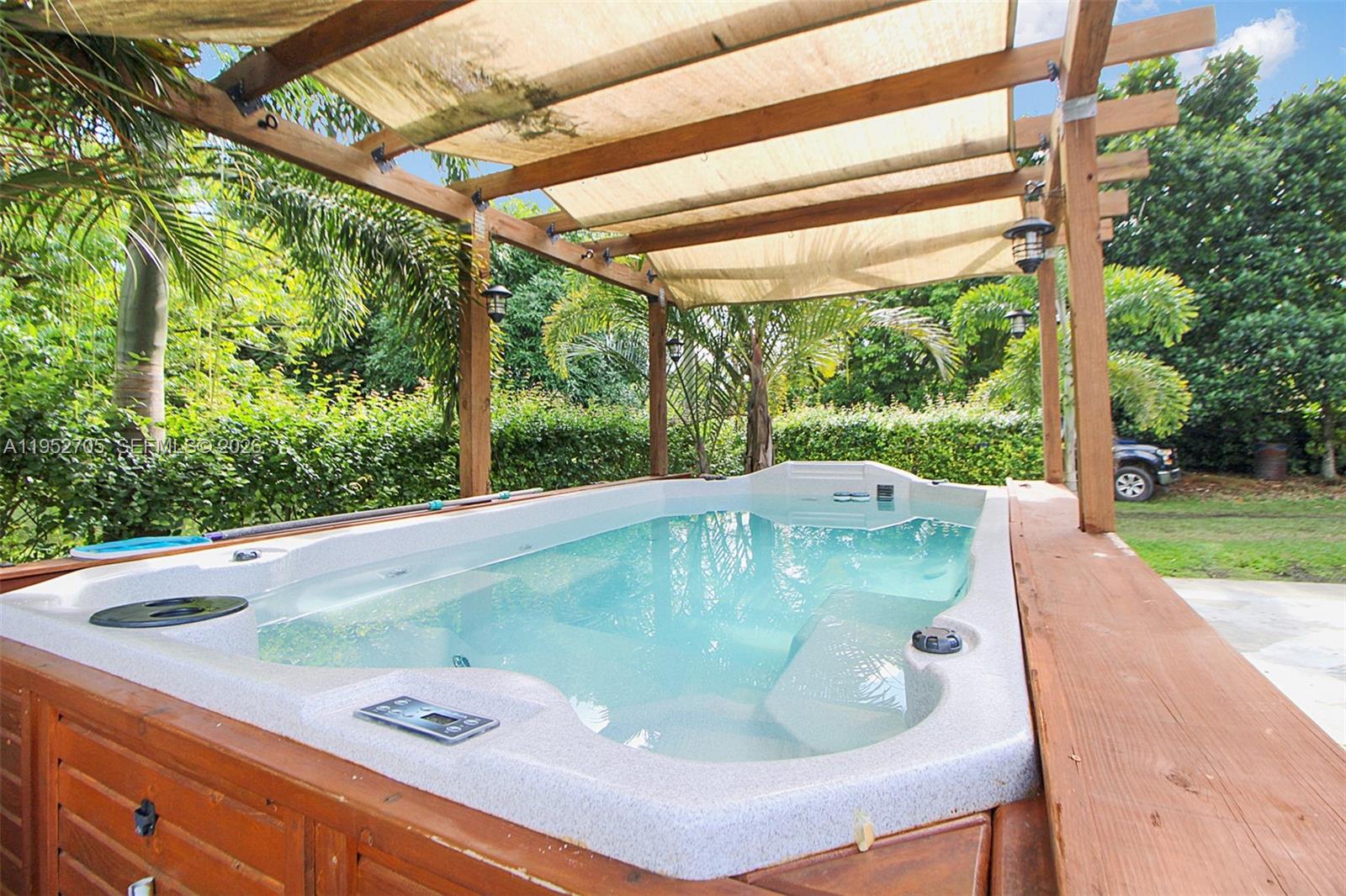 37225 Southwest 214th Avenue Homestead, FL 33034 - Photo 33 of 77 a view of outdoor space with swimming pool and outdoor space