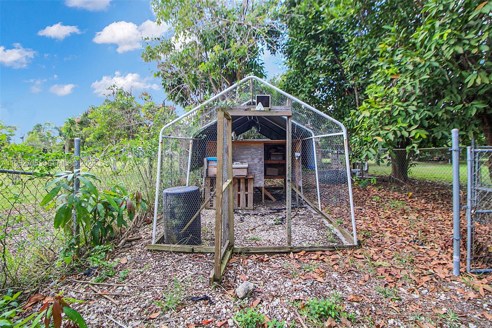 37225 Southwest 214th Avenue Homestead, FL 33034 - Photo 45 of 77 a front view of a house with garden