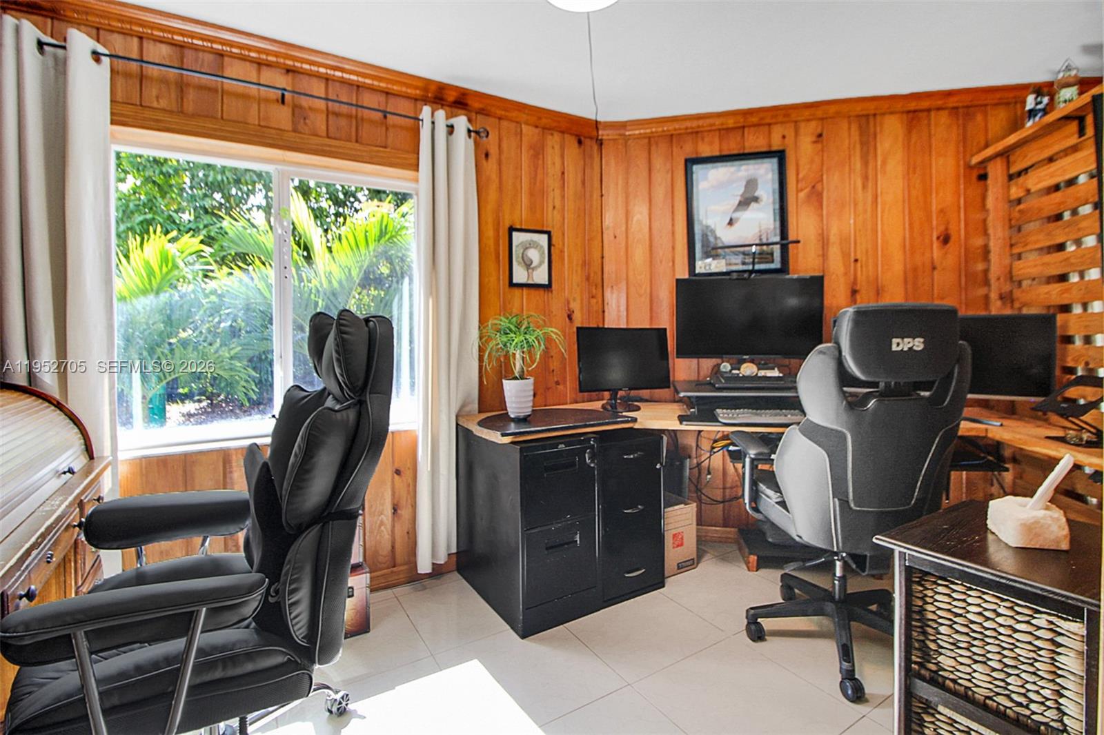 37225 Southwest 214th Avenue Homestead, FL 33034 - Photo 54 of 77 a view of a workspace with furniture and a window
