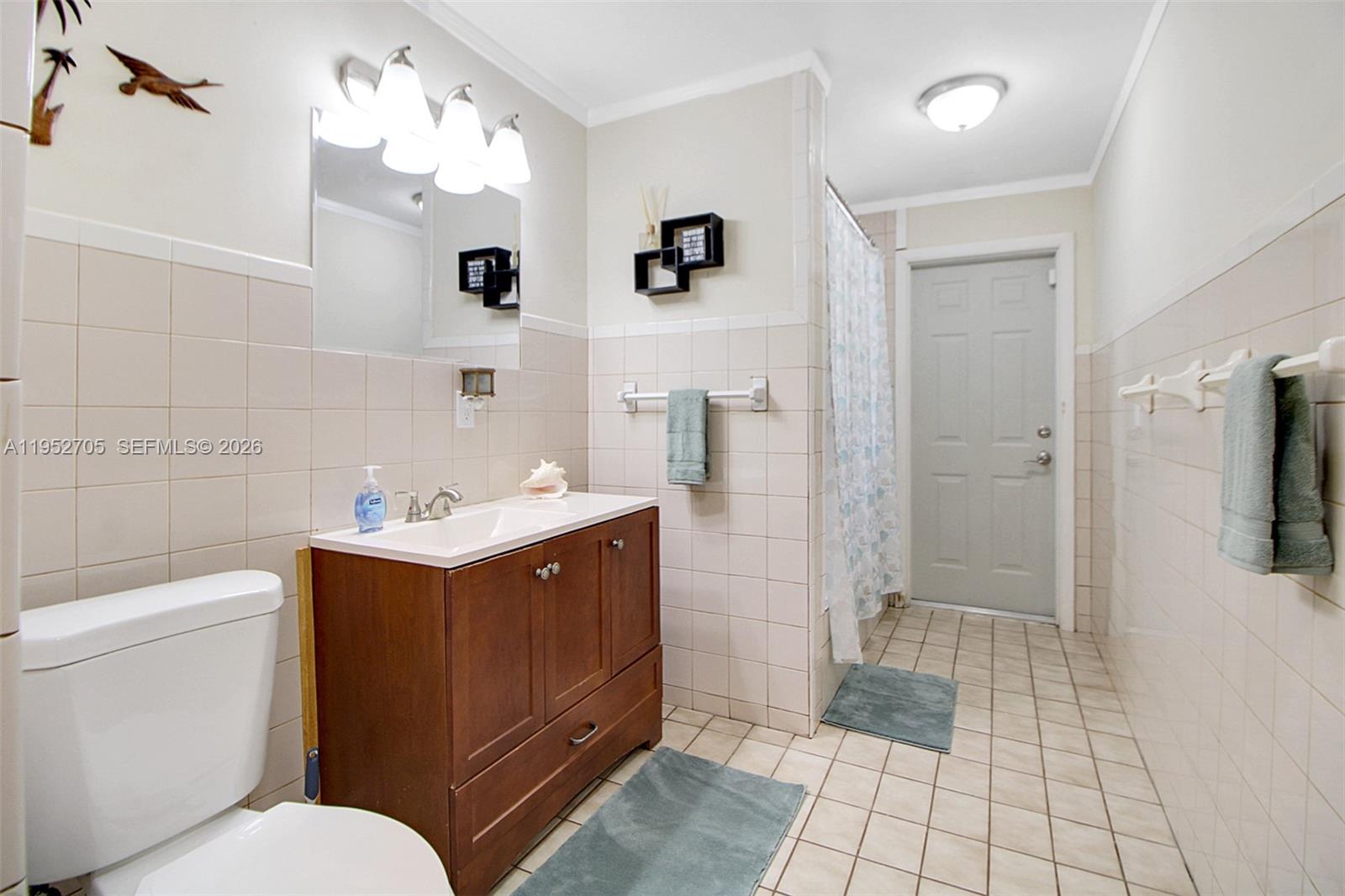 37225 Southwest 214th Avenue Homestead, FL 33034 - Photo 63 of 77 a bathroom with a sink a toilet and shower