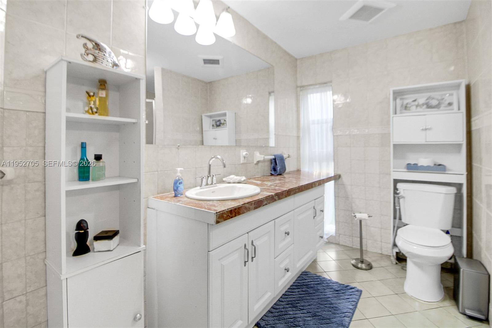 37225 Southwest 214th Avenue Homestead, FL 33034 - Photo 67 of 77 a bathroom with a sink a toilet and shower