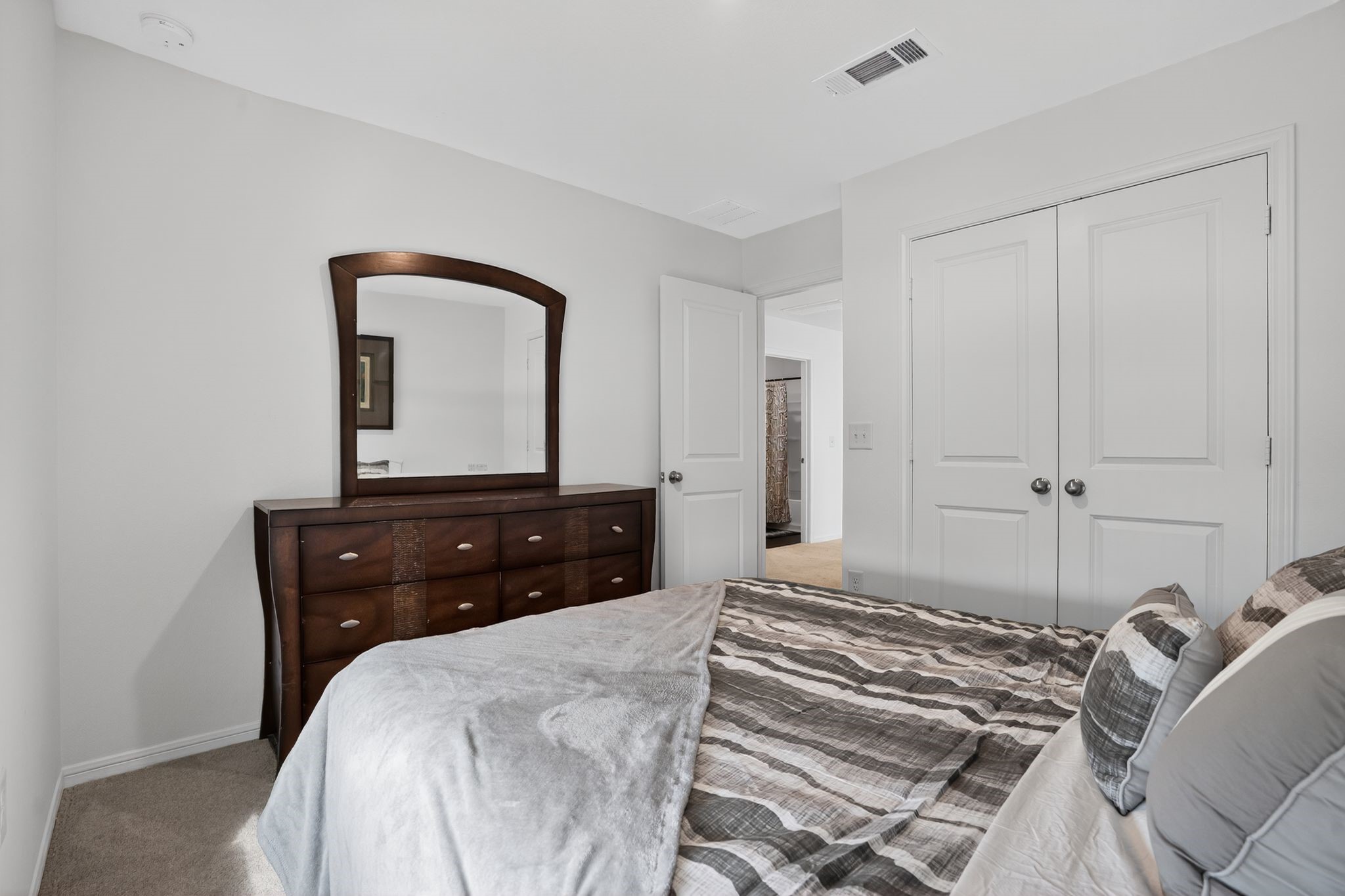 17866 Juneberry Seed Street Hockley, TX 77447 - Photo 15 of 26 a bedroom with a bed and a dresser