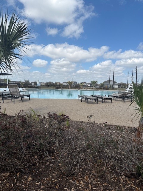 17866 Juneberry Seed Street Hockley, TX 77447 - Photo 23 of 26 a view of a lake with houses in the background