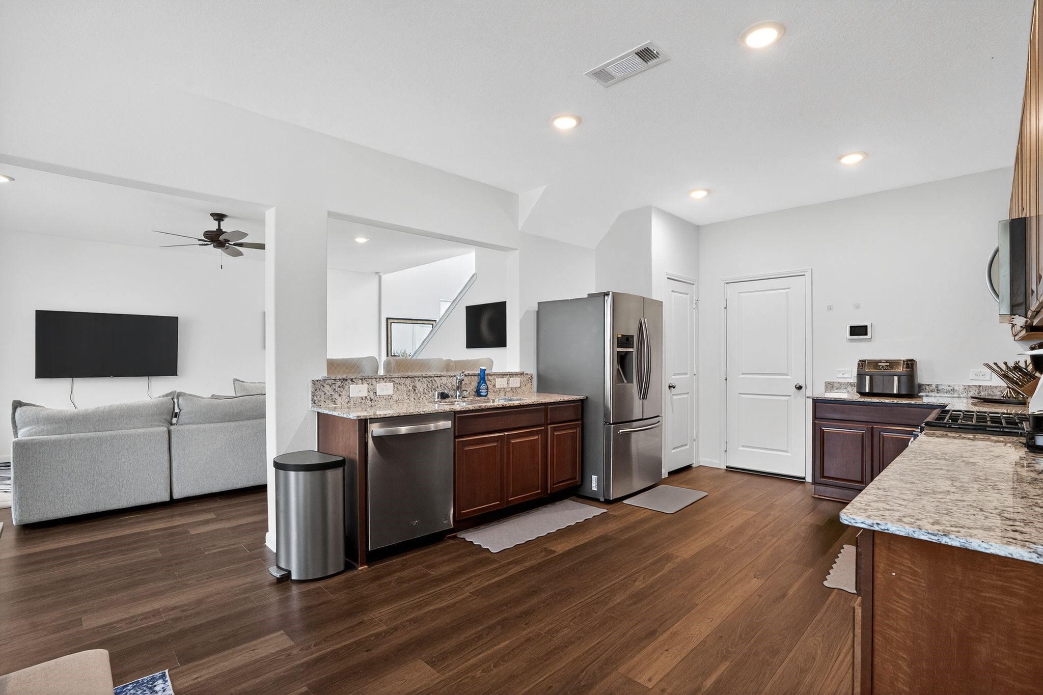 17866 Juneberry Seed Street Hockley, TX 77447 - Photo 5 of 26 a large kitchen with a table and chairs
