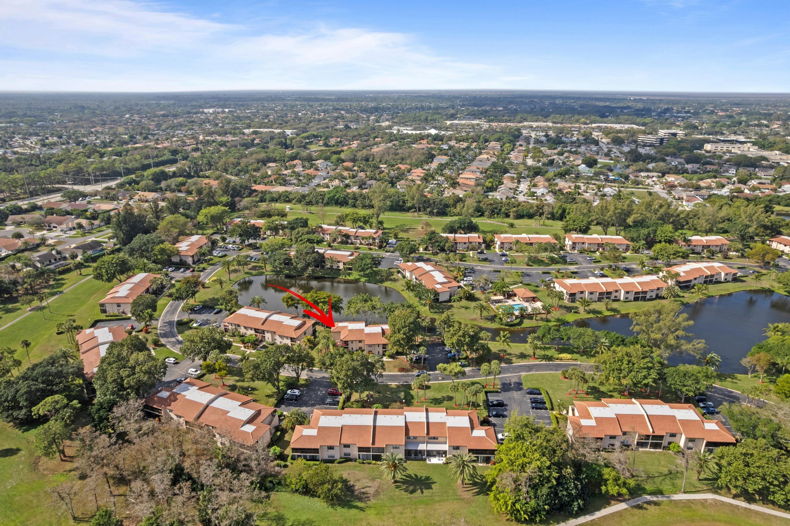 9265 Vista Del Lago, Unit 41B Boca Raton, FL 33428 - Photo 25 of 42 an aerial view of residential building with green space