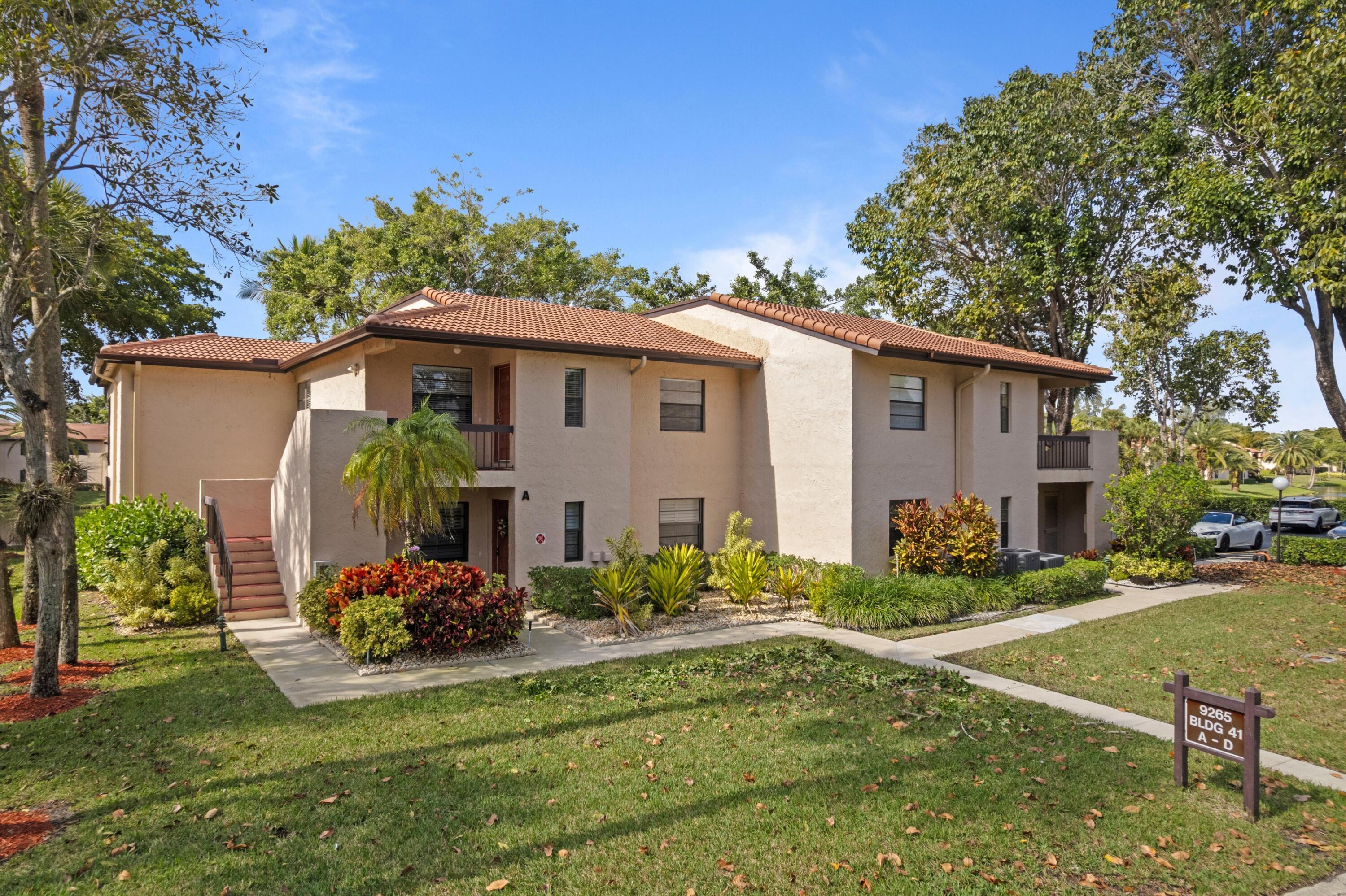 9265 Vista Del Lago, Unit 41B Boca Raton, FL 33428 - Photo 29 of 42 a view of a house with backyard and sitting area