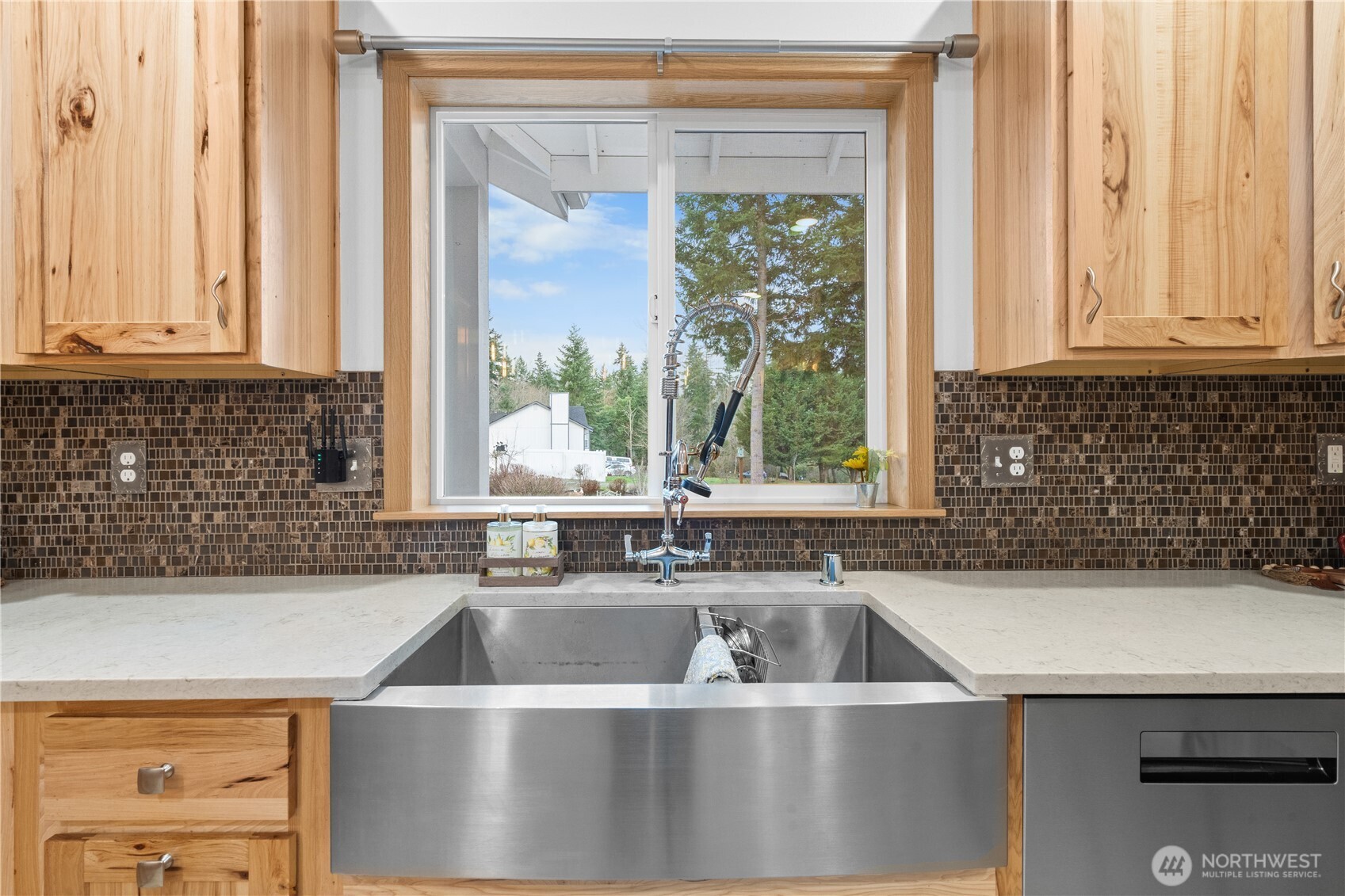 15840 Lawrence Lake Road Southeast Yelm, WA 98597 - Photo 13 of 40 a view of a kitchen counter top a sink and a window