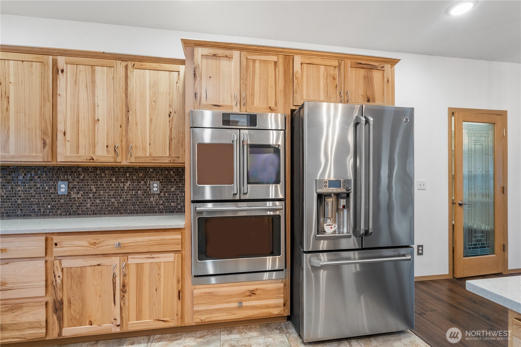 15840 Lawrence Lake Road Southeast Yelm, WA 98597 - Photo 15 of 40 a kitchen with stainless steel appliances granite countertop a refrigerator and a stove top oven