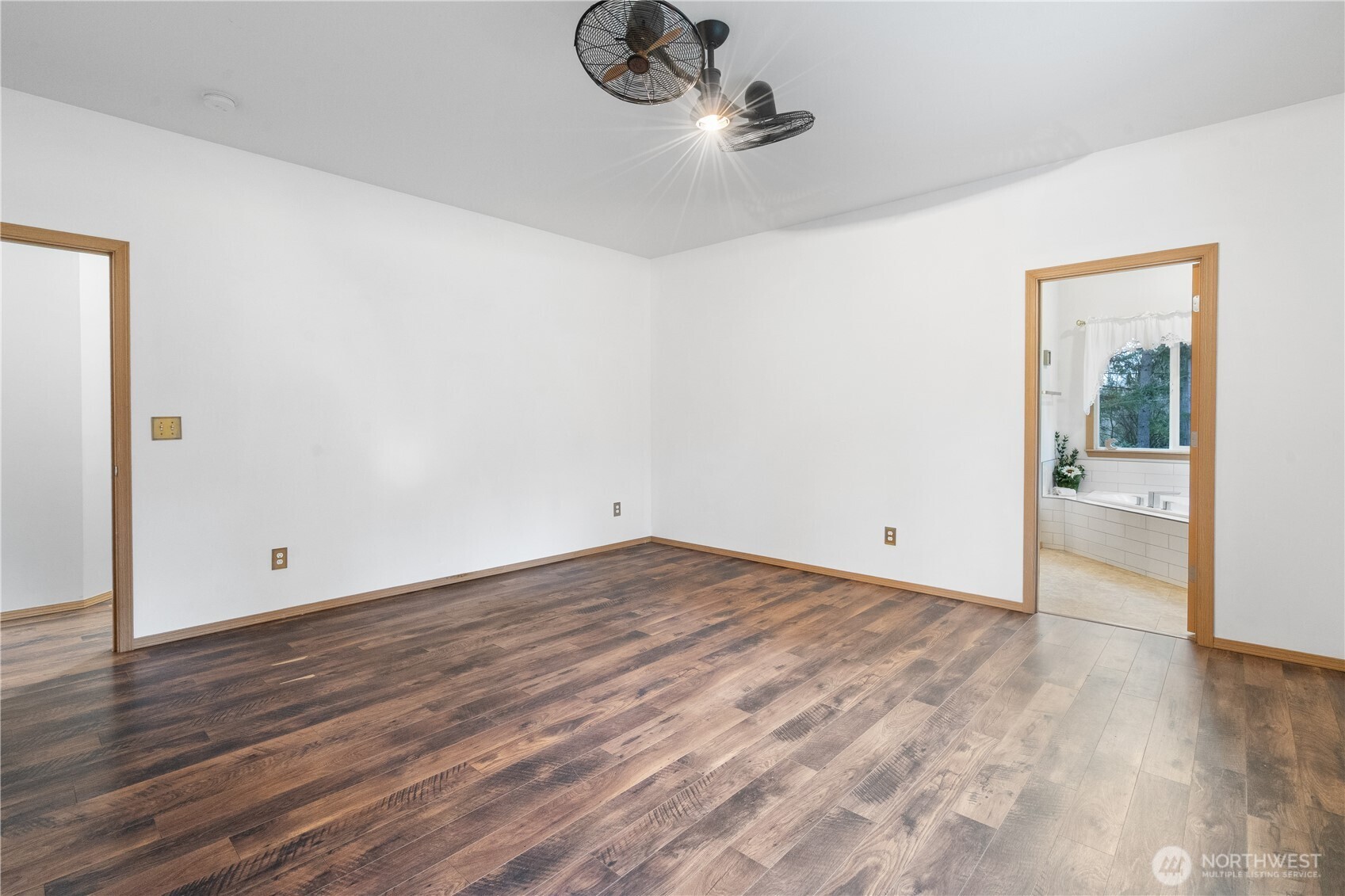 15840 Lawrence Lake Road Southeast Yelm, WA 98597 - Photo 18 of 40 a view of empty room with wooden floor