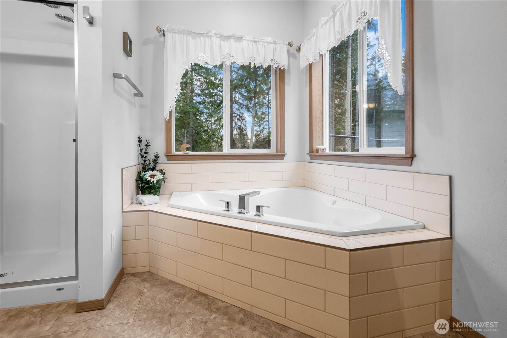 15840 Lawrence Lake Road Southeast Yelm, WA 98597 - Photo 21 of 40 a bathroom with a sink and a bathtub