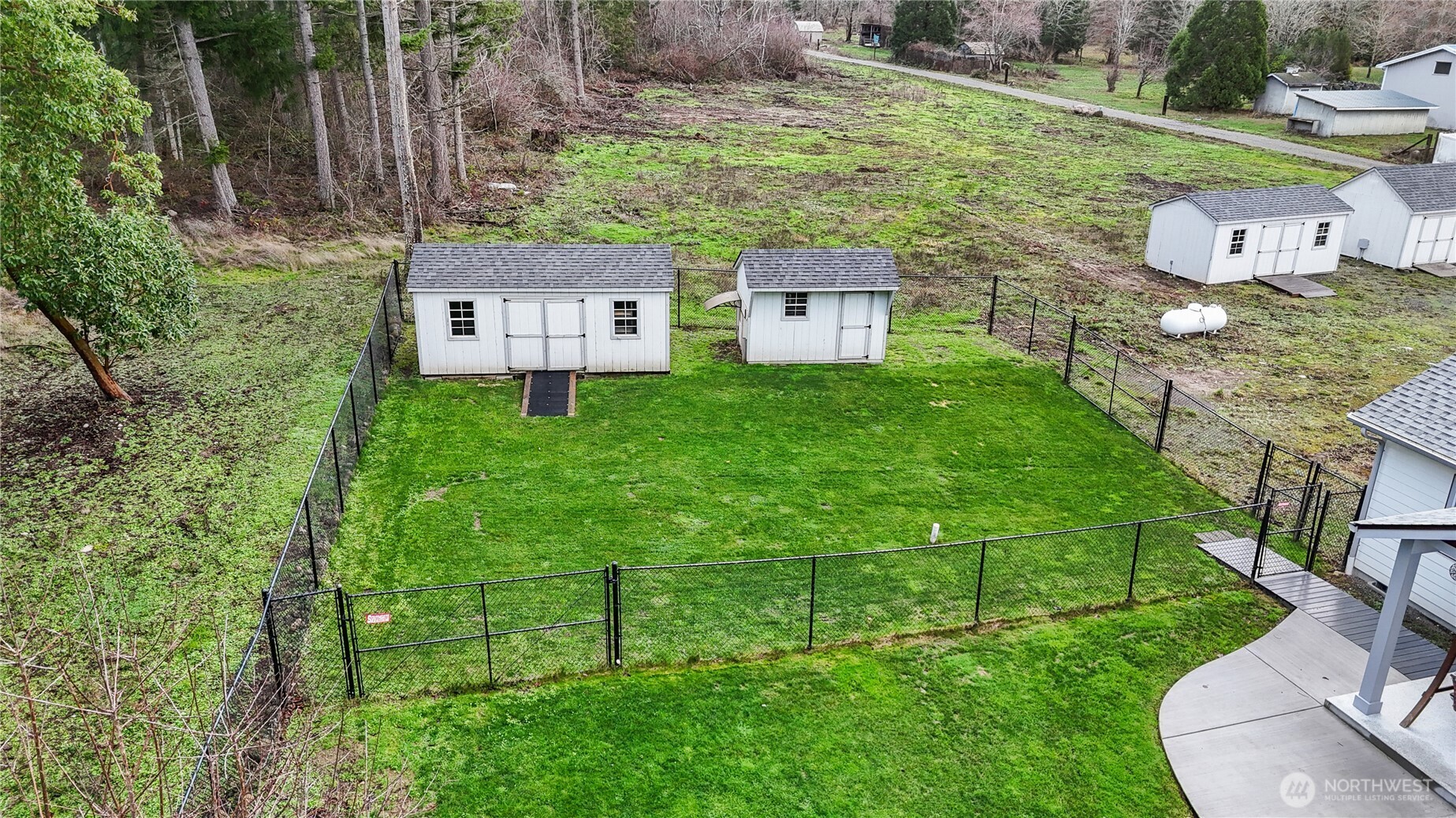 15840 Lawrence Lake Road Southeast Yelm, WA 98597 - Photo 33 of 40 a view of a house with a yard
