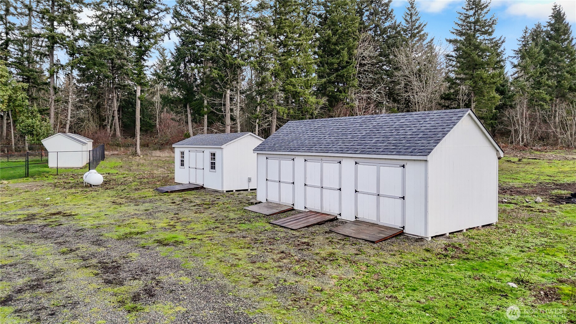 15840 Lawrence Lake Road Southeast Yelm, WA 98597 - Photo 34 of 40 a view of a backyard with barn and a sink