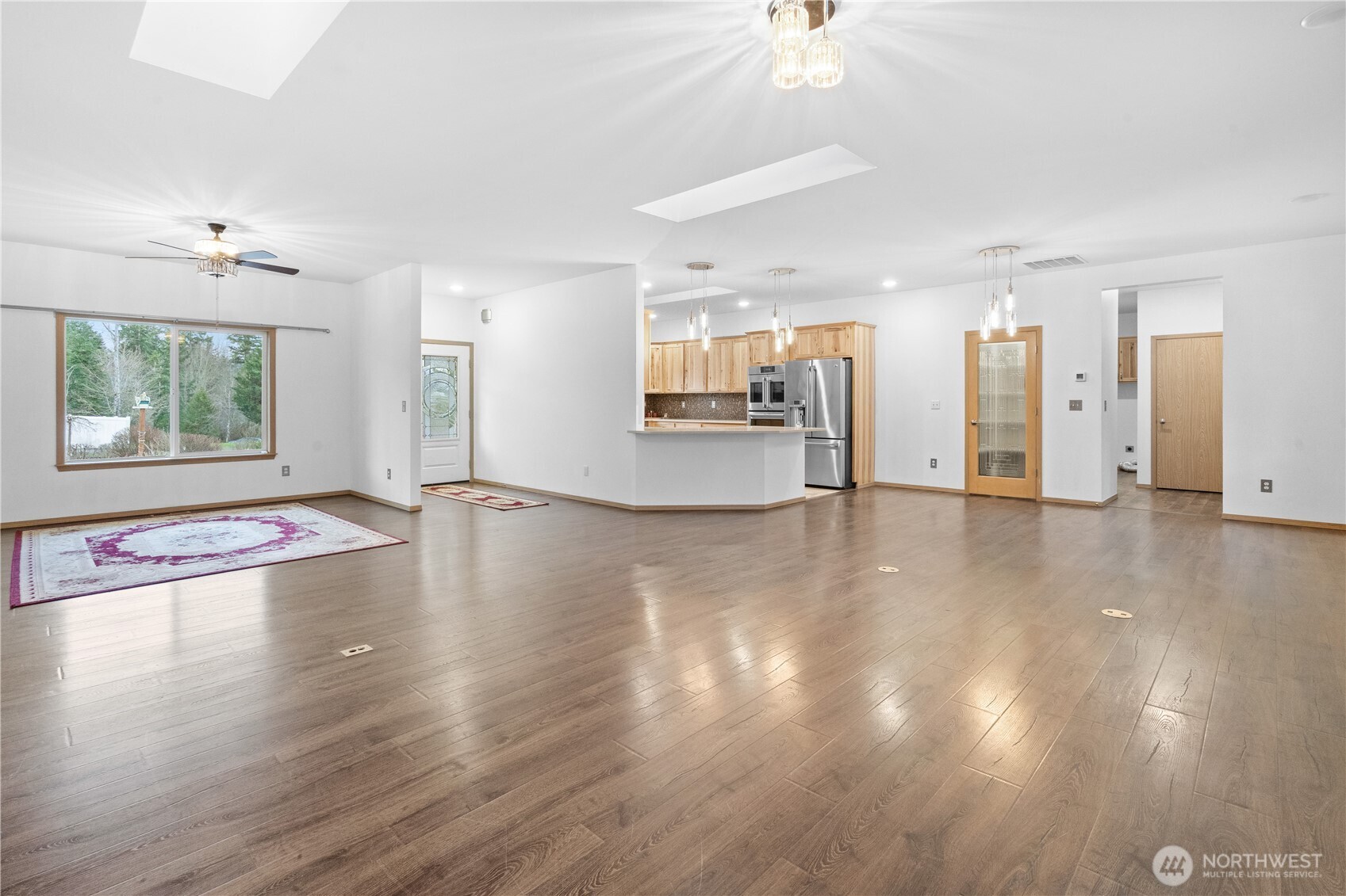 15840 Lawrence Lake Road Southeast Yelm, WA 98597 - Photo 6 of 40 a view of a kitchen with a sink and a large window