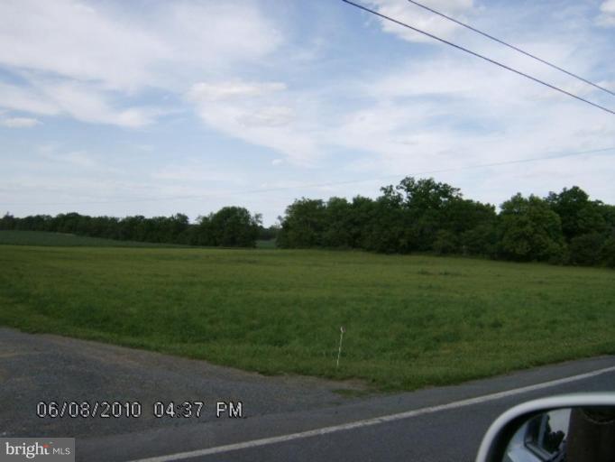 Leetown Rd Summit Point West Kearneysville, WV 25430 - Photo 1 of 1 a view of a grassy field with trees