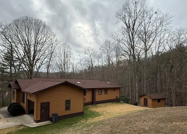 a house with trees in the background