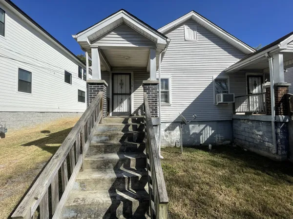 a view of an house with balcony and wooden floor