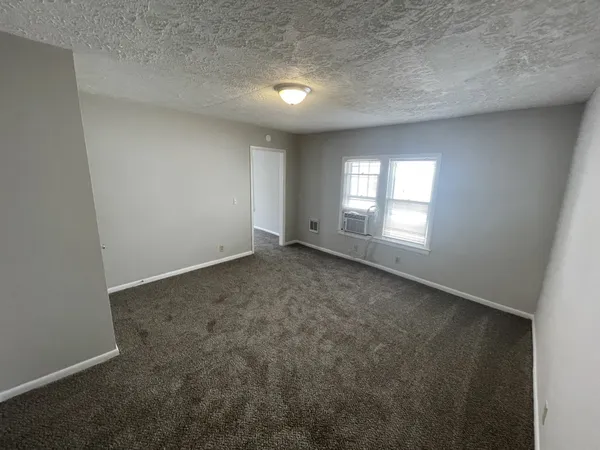 an empty room with windows