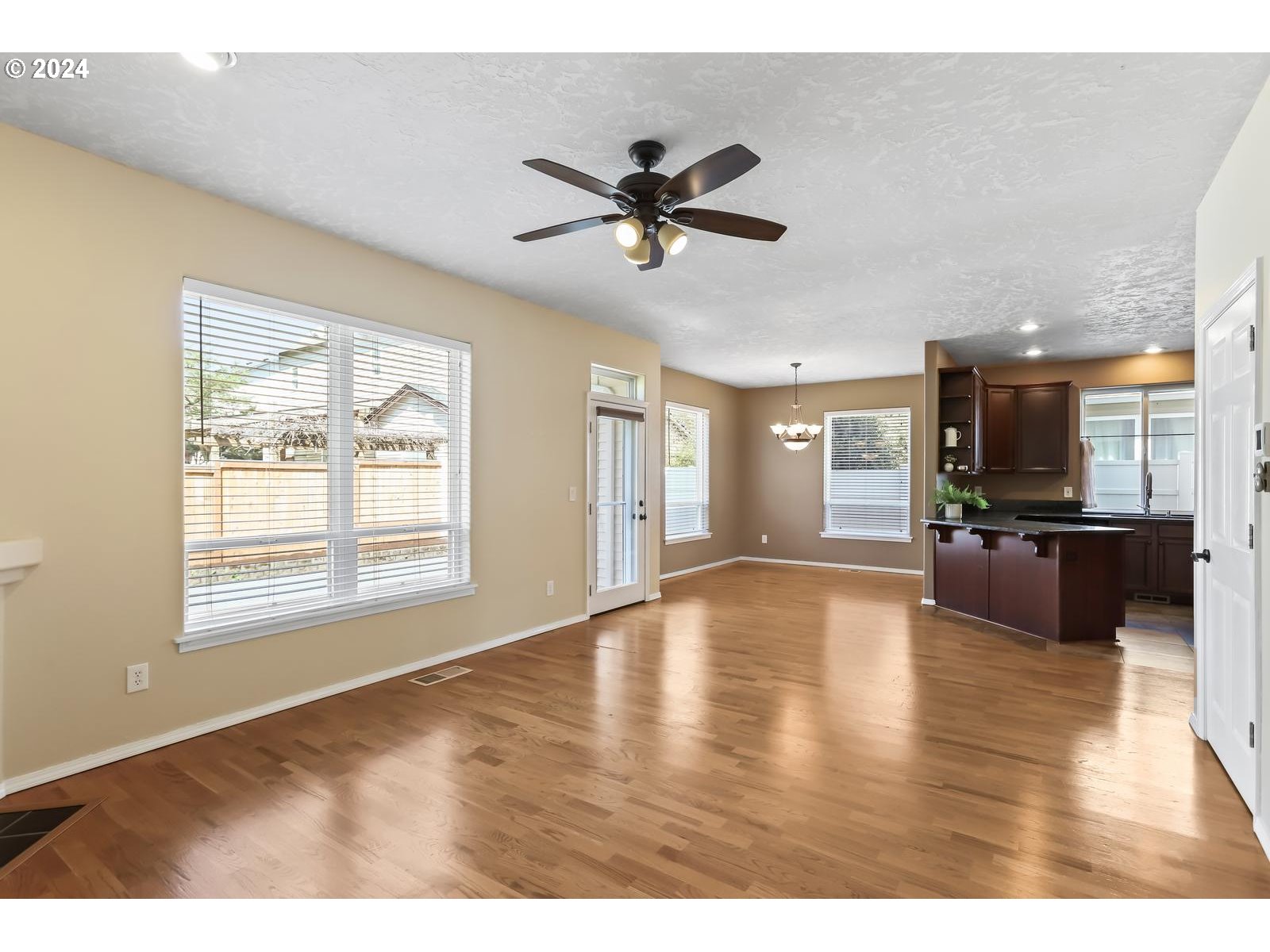 18283 Davis Street Sandy, OR 97055 - Photo 12 of 42 a view of an empty room with window and wooden floor