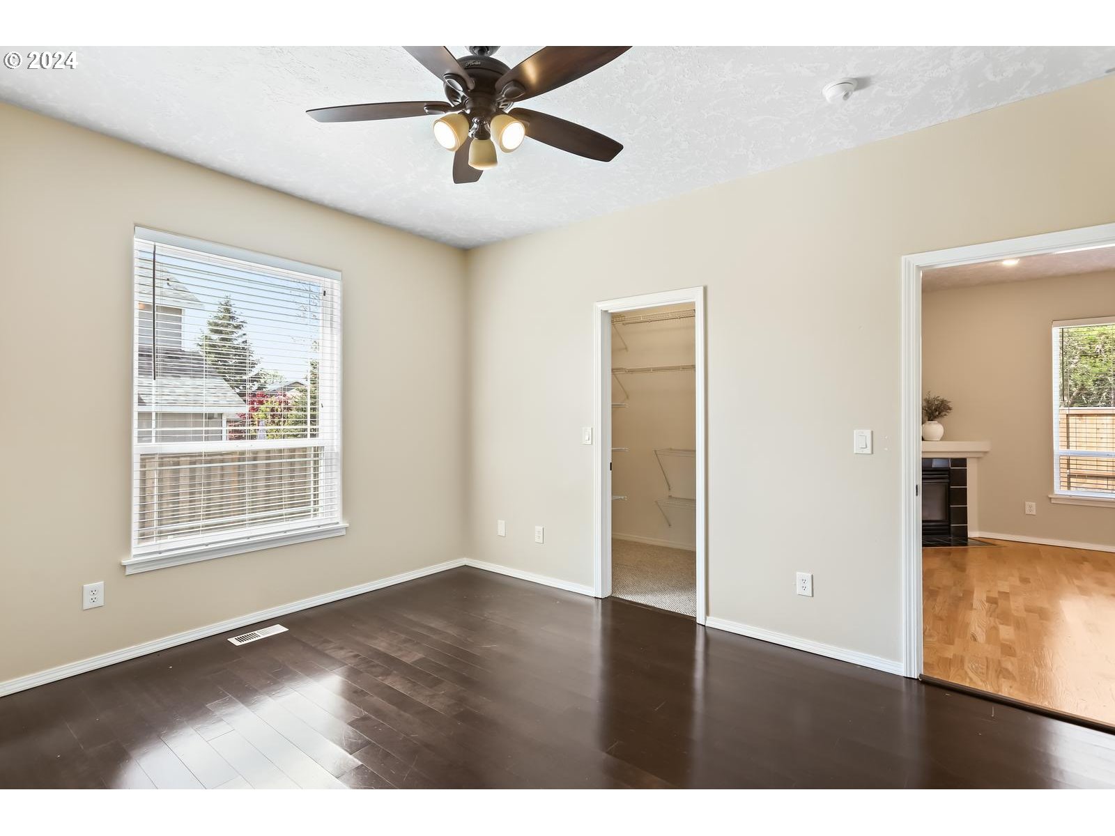 18283 Davis Street Sandy, OR 97055 - Photo 18 of 42 a view of an empty room with wooden floor and a window