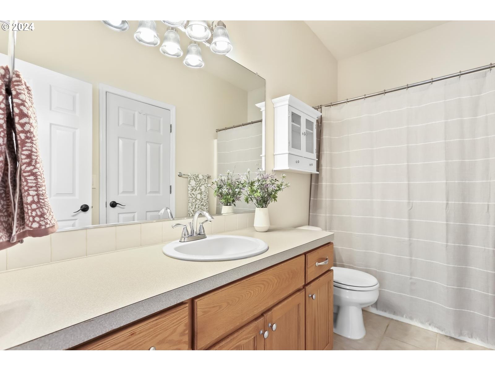 18283 Davis Street Sandy, OR 97055 - Photo 20 of 42 a bathroom with a sink a toilet and a mirror