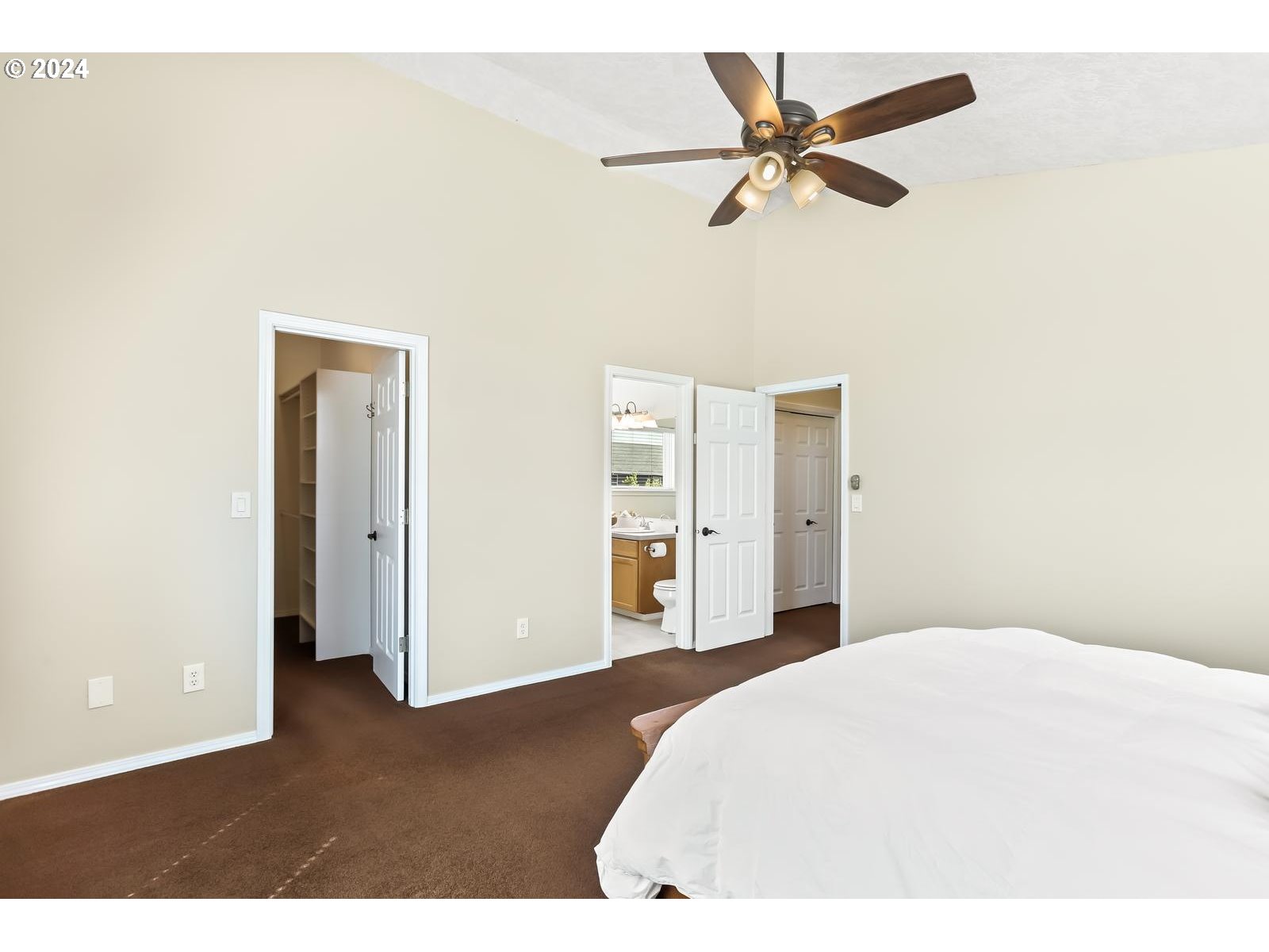 18283 Davis Street Sandy, OR 97055 - Photo 23 of 42 a bedroom with a bed and a ceiling fan
