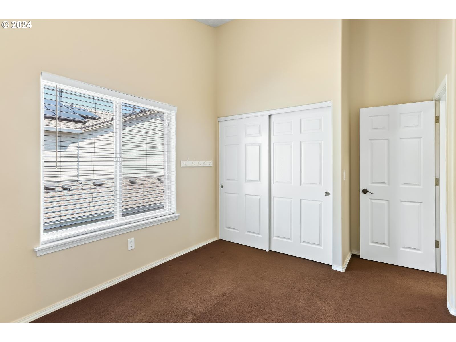 18283 Davis Street Sandy, OR 97055 - Photo 31 of 42 a view of an empty room with wooden floor and a window