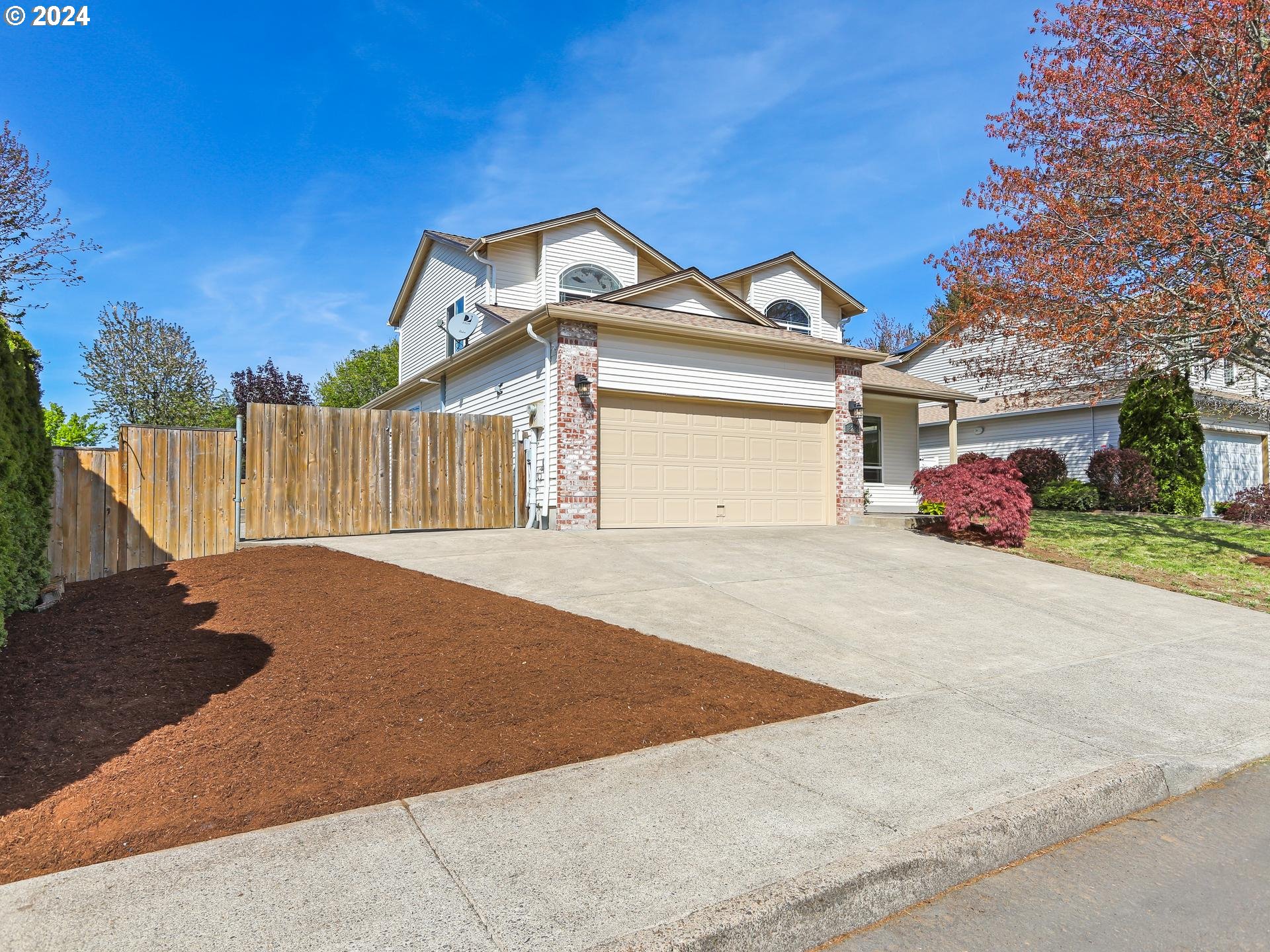 18283 Davis Street Sandy, OR 97055 - Photo 39 of 42 a front view of a house with a yard and garage