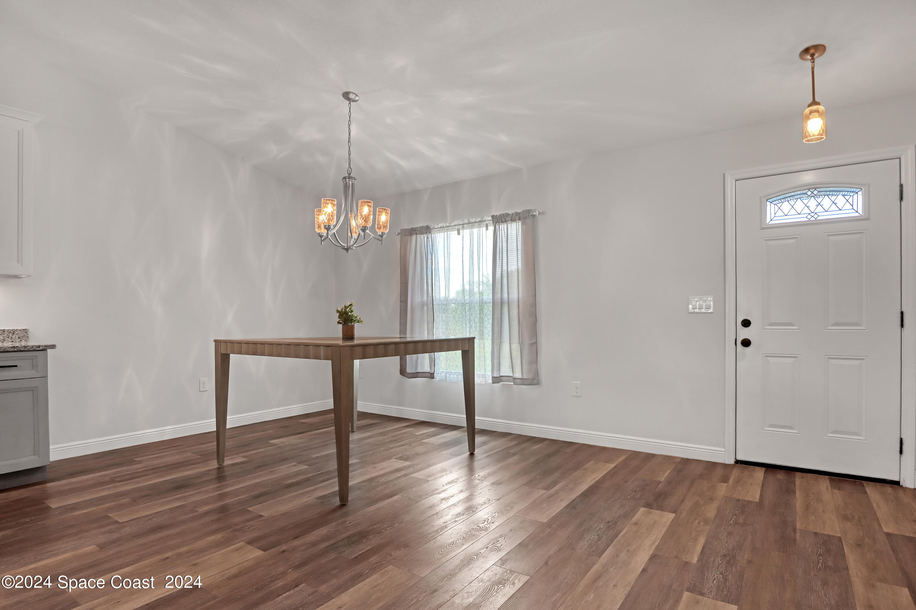4383 Prentice Lane Mims, FL 32754 - Photo 12 of 48 a view of a room with wooden floor fan and window