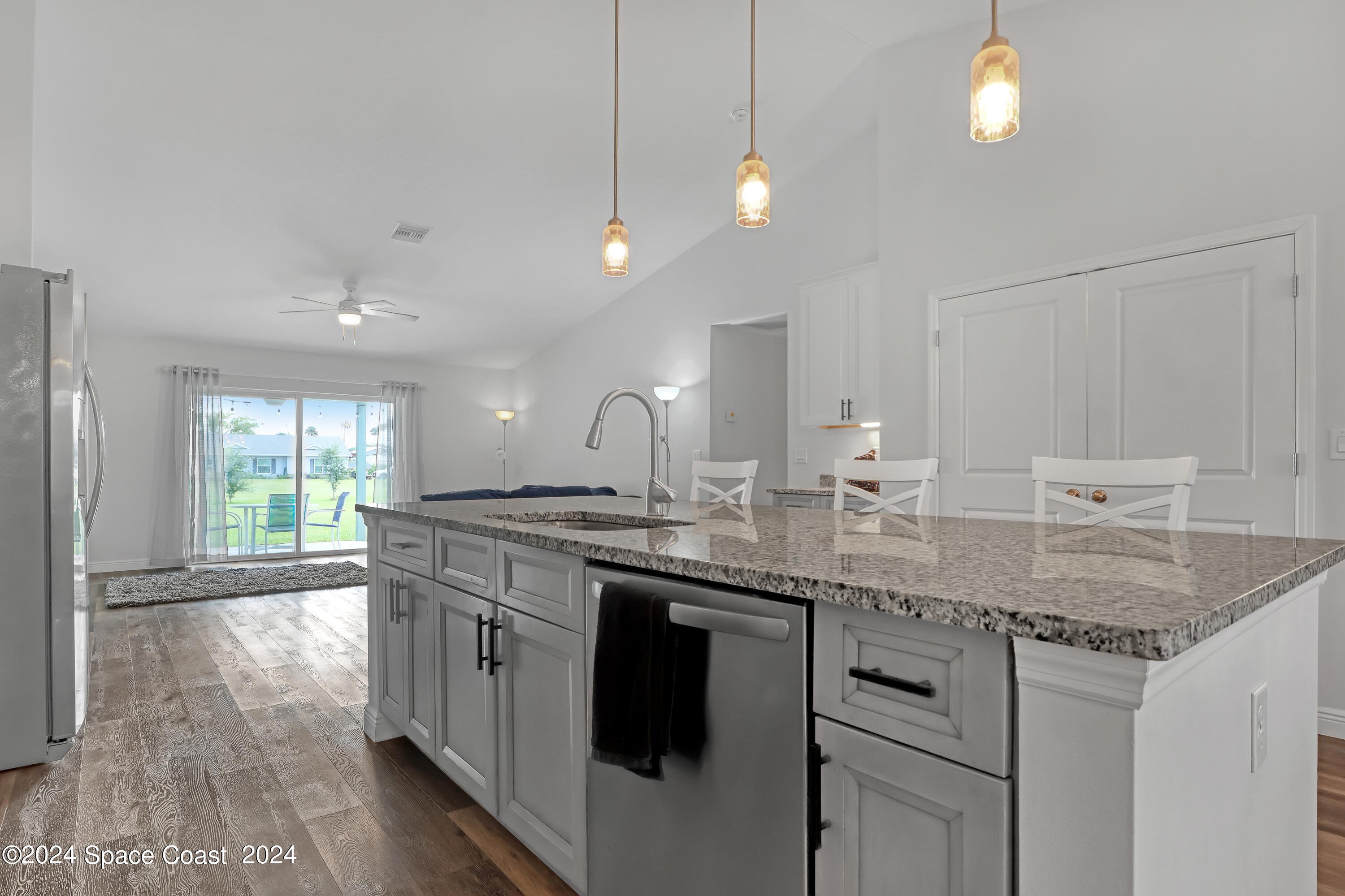 4383 Prentice Lane Mims, FL 32754 - Photo 19 of 48 a kitchen with center island and stainless steel appliances