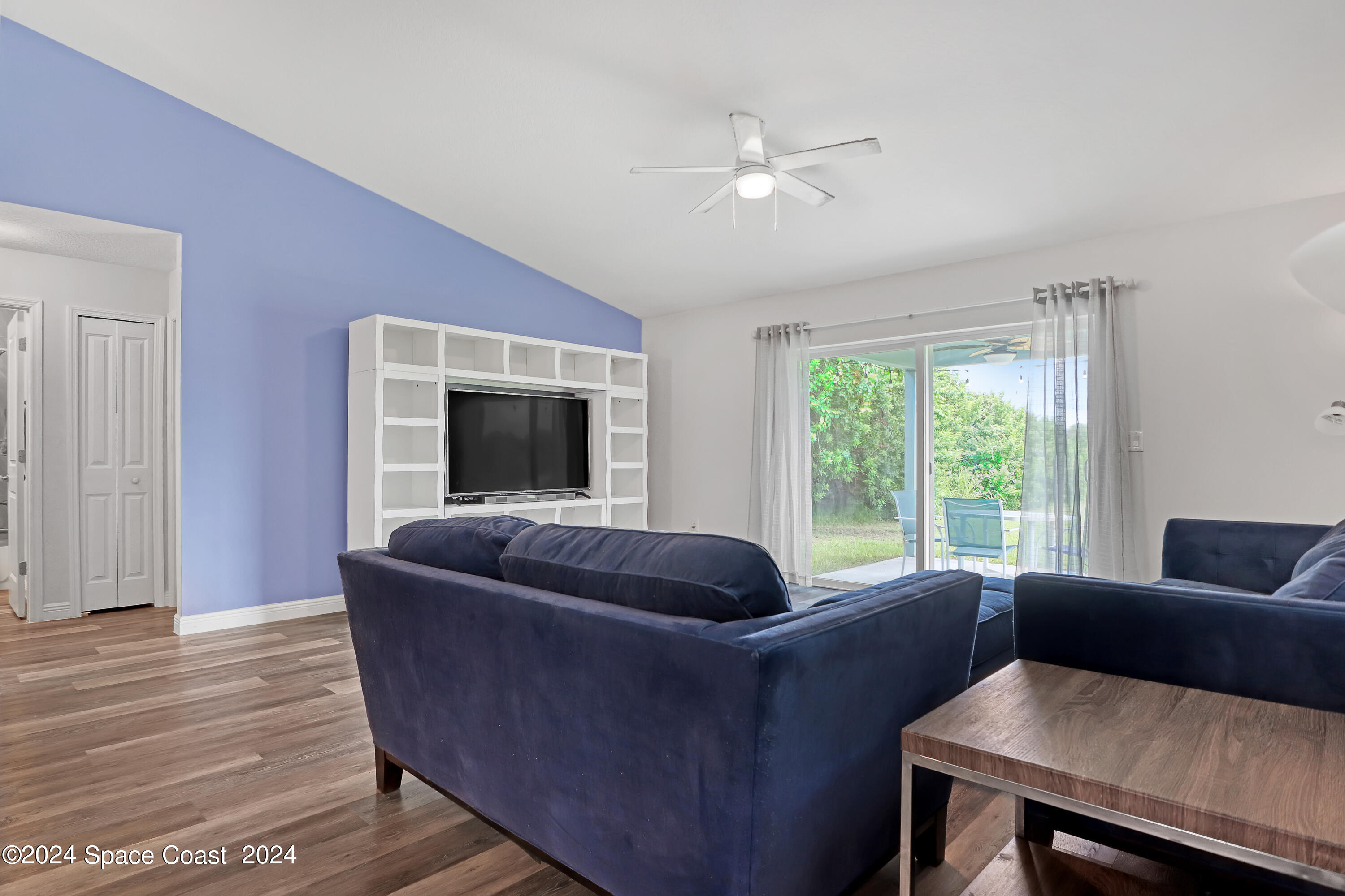 4383 Prentice Lane Mims, FL 32754 - Photo 21 of 48 a living room with furniture and a large window